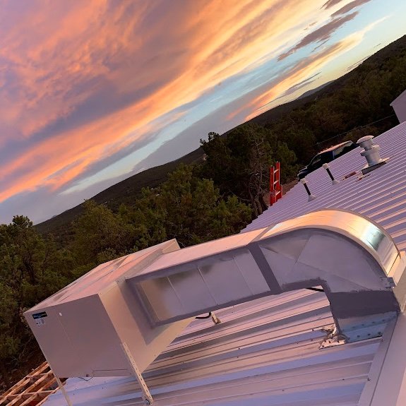Air Dynamics of Tulsa technician inspecting home ductwork during a service visit.
